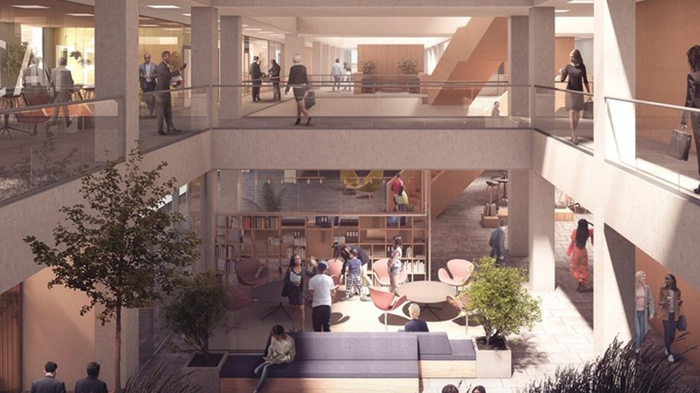 Visualisering af det indre i den kommende kontorbygning med kig ned i et stort foyerområde samt kig ind på gangene på 1. sal