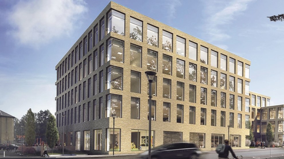 Visualisering af den kommende kontorbygning til Udlændingestyrelsen i Næstved. Bygningen fremstår med gule mursten i fem etager med symmetrisk placerede kvadratiske vinduespartier